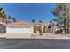 Charming single-story home with a two-car garage and well-manicured landscaping at 8300 Slate Harbor Cir, Las Vegas, NV 89128