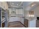 Bright kitchen features stainless steel appliances, granite countertops, and white cabinetry at 8300 Slate Harbor Cir, Las Vegas, NV 89128