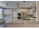 Modern kitchen showcasing granite countertops, stainless appliances, and bright recessed lighting at 8300 Slate Harbor Cir, Las Vegas, NV 89128
