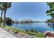 Scenic view of the lakefront property featuring lush shoreline and waterfront homes at 8300 Slate Harbor Cir, Las Vegas, NV 89128