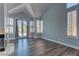 Living area showcasing hardwood floors, high ceilings, and natural light through shuttered windows at 8300 Slate Harbor Cir, Las Vegas, NV 89128