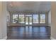 Spacious living room with hardwood floors and abundant natural light overlooking the pool at 8300 Slate Harbor Cir, Las Vegas, NV 89128