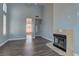Spacious living room with hardwood floors, a fireplace, and an open layout at 8300 Slate Harbor Cir, Las Vegas, NV 89128
