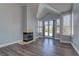 Bright living room features modern flooring, high ceilings, and a fireplace at 8300 Slate Harbor Cir, Las Vegas, NV 89128