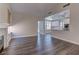 Bright living area with hardwood floors and seamless flow into the modern kitchen at 8300 Slate Harbor Cir, Las Vegas, NV 89128