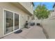 View of the patio with sliding door access, a barbecue grill and partial fencing at 8335 Martinborough Ave, Las Vegas, NV 89131