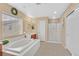Bright bathroom with a tub and stand up shower at 8335 Martinborough Ave, Las Vegas, NV 89131