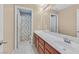 Bathroom with a large mirror, a single sink vanity, and a shower/tub combination at 8335 Martinborough Ave, Las Vegas, NV 89131