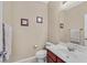 Neat bathroom with white sink, toilet, and tiled floors at 8335 Martinborough Ave, Las Vegas, NV 89131