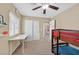 Bedroom featuring a bunk bed, a desk, ceiling fan, and neutral colored walls at 8335 Martinborough Ave, Las Vegas, NV 89131