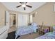Bedroom featuring two twin beds, a ceiling fan, and decorations on the walls at 8335 Martinborough Ave, Las Vegas, NV 89131