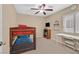 Bedroom featuring a bunk bed, a desk, ceiling fan, and neutral colored walls at 8335 Martinborough Ave, Las Vegas, NV 89131
