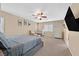 Spacious bedroom with a fan, carpeted floors, and a window at 8335 Martinborough Ave, Las Vegas, NV 89131