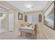 Cozy dining room featuring carpeted floors, stylish decor, and a window for natural light at 8335 Martinborough Ave, Las Vegas, NV 89131