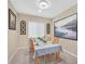 Well lit dining room featuring carpeted floors, stylish decor, and a window at 8335 Martinborough Ave, Las Vegas, NV 89131