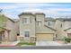 Charming two-story home featuring a well-manicured lawn and attached two-car garage at 8335 Martinborough Ave, Las Vegas, NV 89131