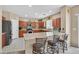 Well-equipped kitchen with granite countertops, breakfast bar, stainless steel appliances, and tile backsplash at 8335 Martinborough Ave, Las Vegas, NV 89131