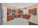 Stylish kitchen featuring granite countertops, stainless steel appliances, and ample cabinet space at 8335 Martinborough Ave, Las Vegas, NV 89131