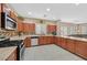 Modern kitchen with stainless steel appliances, granite countertops, and ample counter space for cooking at 8335 Martinborough Ave, Las Vegas, NV 89131