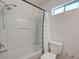 Bathroom with a combined shower and tub, toilet, and a small window for natural light at 8396 Pearl Beach Ct, Las Vegas, NV 89139