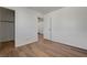 A bedroom featuring wood-look flooring, closet, and access to other rooms at 8396 Pearl Beach Ct, Las Vegas, NV 89139