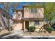 Charming two-story home with desert landscaping, attached garage, and stucco exterior at 8396 Pearl Beach Ct, Las Vegas, NV 89139