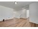 Open hallway with wood-look flooring and access to other rooms at 8396 Pearl Beach Ct, Las Vegas, NV 89139