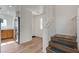 Hallway with kitchen, stairs, and front door at 8396 Pearl Beach Ct, Las Vegas, NV 89139