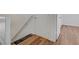 Hallway features wood-look floors and a handrail alongside a staircase at 8396 Pearl Beach Ct, Las Vegas, NV 89139