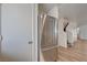 Hallway with stainless steel fridge and view of wooden stairs at 8396 Pearl Beach Ct, Las Vegas, NV 89139
