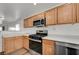 Bright kitchen features wood cabinets, white countertops, and stainless steel appliances at 8396 Pearl Beach Ct, Las Vegas, NV 89139