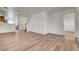 Spacious living room with new flooring throughout the home, leading to an open kitchen at 8396 Pearl Beach Ct, Las Vegas, NV 89139