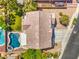 Birds eye view of home showing backyard pool, patio, and lawn at 8516 Canyon Ranch St, Las Vegas, NV 89131