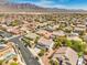 Expansive aerial view of a neighborhood with mountain backdrop at 8516 Canyon Ranch St, Las Vegas, NV 89131