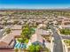 Neighborhood aerial with pools and mature trees at 8516 Canyon Ranch St, Las Vegas, NV 89131
