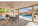 Covered patio perfect for outdoor dining with BBQ, overlooks a pool and spa at 8516 Canyon Ranch St, Las Vegas, NV 89131