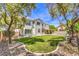 Large backyard features a well-maintained lawn, mature trees, and a pool at 8516 Canyon Ranch St, Las Vegas, NV 89131