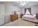 Bedroom featuring a bed, a desk, a dresser, and a window with curtains at 8516 Canyon Ranch St, Las Vegas, NV 89131