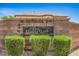 Wolf Creek community sign surrounded by lush green landscaping at 8516 Canyon Ranch St, Las Vegas, NV 89131