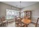 Dining room featuring hardwood floors, chandelier, dining table set, and china cabinet at 8516 Canyon Ranch St, Las Vegas, NV 89131