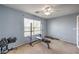 Exercise room featuring a weight rack, adjustable dumbbells and a weight lifting bench in front of a window at 8516 Canyon Ranch St, Las Vegas, NV 89131