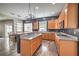 Kitchen with granite counters and a gas cooktop and bar seating area at 8516 Canyon Ranch St, Las Vegas, NV 89131