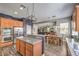 Kitchen with stainless steel appliances, granite counters and view to the living room at 8516 Canyon Ranch St, Las Vegas, NV 89131