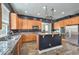 Kitchen with stainless steel appliances, granite counters, and a pot rack at 8516 Canyon Ranch St, Las Vegas, NV 89131