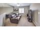 Spacious living room with a comfortable leather sofa, TV, and recreational table at 8516 Canyon Ranch St, Las Vegas, NV 89131