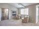 Comfortable living room featuring neutral walls, a fireplace and a seating area at 8516 Canyon Ranch St, Las Vegas, NV 89131