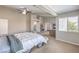 Bright main bedroom featuring high ceilings, a ceiling fan and natural light at 8516 Canyon Ranch St, Las Vegas, NV 89131