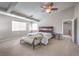 Spacious main bedroom featuring high ceilings, natural light, and chaise lounge at 8516 Canyon Ranch St, Las Vegas, NV 89131