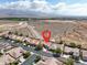 Neighborhood aerial view displaying the house location, tile roofs, desert landscape, and mountain views at 8608 Willow Cabin St, Las Vegas, NV 89131