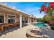 Backyard featuring a covered patio, outdoor furniture and swimming pool at 8608 Willow Cabin St, Las Vegas, NV 89131